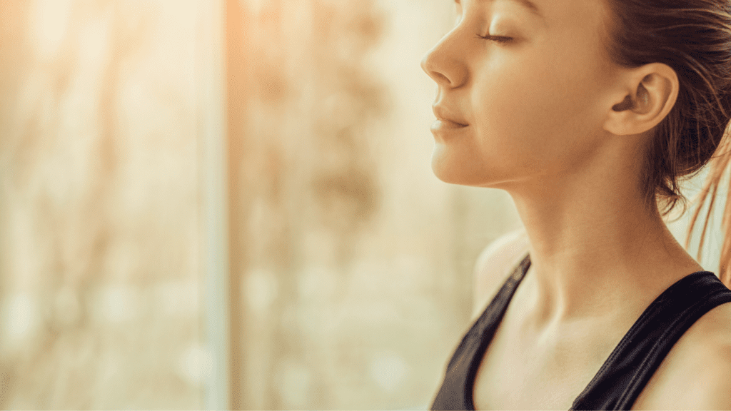 A Photo of a woman doing Ujjayi Breath (Ocean Breath)