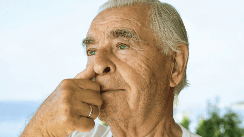 Yoga Breathing Exercises For Sleep Apnea: A Senior Man Doing A Breathing Exercise 