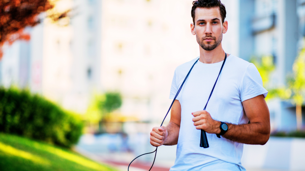 A man holding a skipping rope outdoor