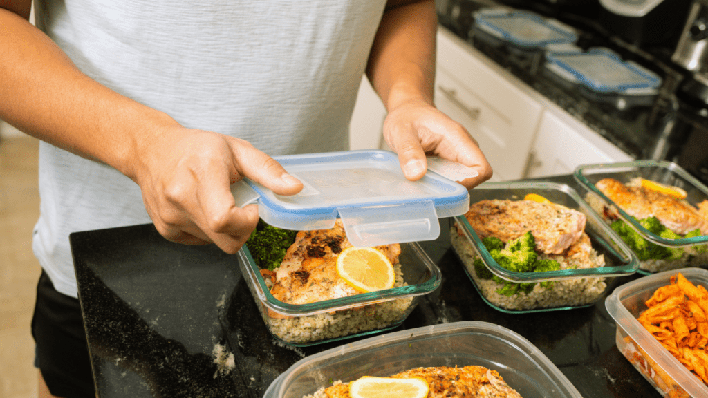 A Man Preparing Boxes Of Food