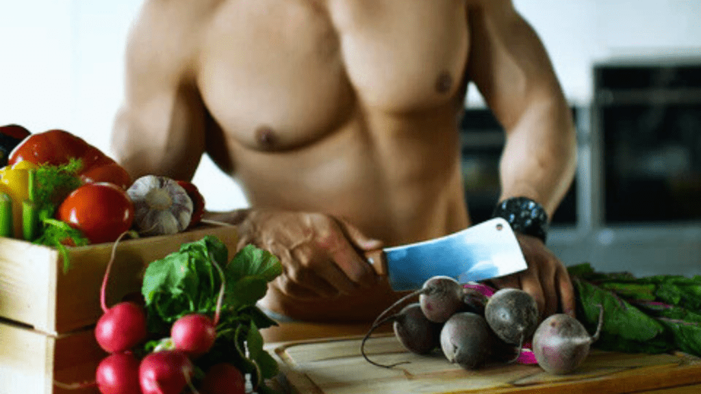 A Bodybuilder Chopping Vegetables 