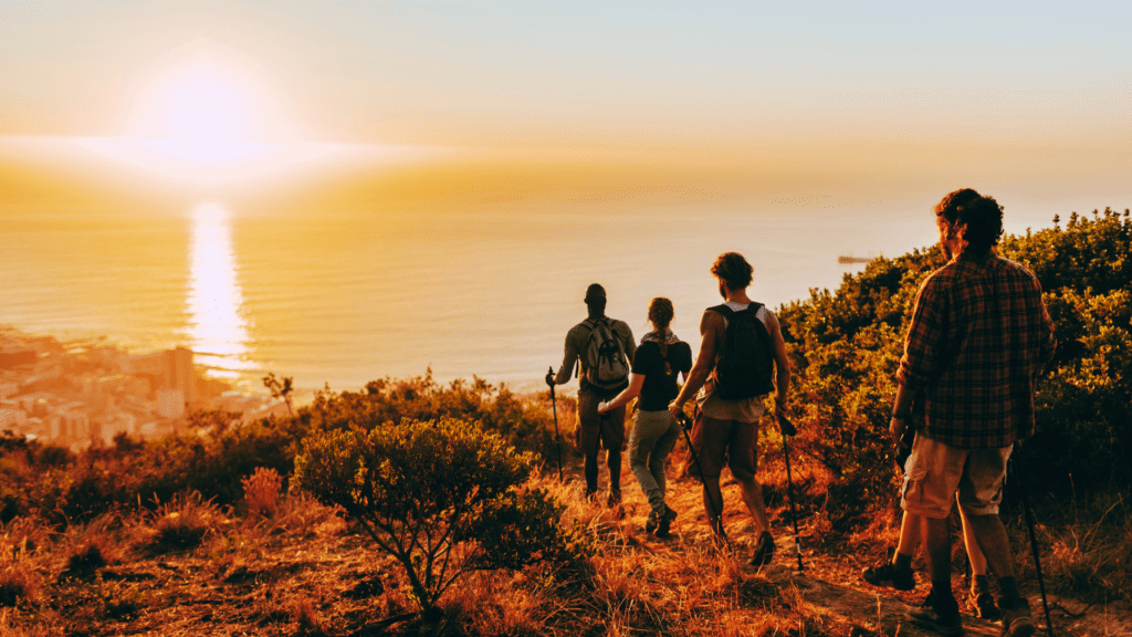 A Group Of People Hiking By The Sea 