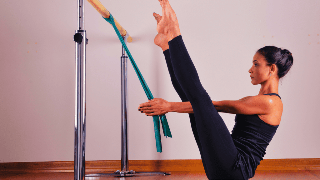 At Home Barre Workout:A Woman Doing Barre Workout With Resistance Band