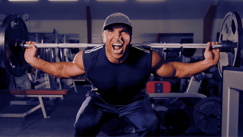 How to Prevent Lower Back Pain When Squatting: A Man Forcing Himself To Do Squat With Heavy Weights 