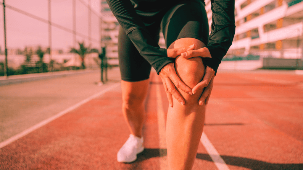 Knee Exercises for Runners: A Runner Holding His Knee 