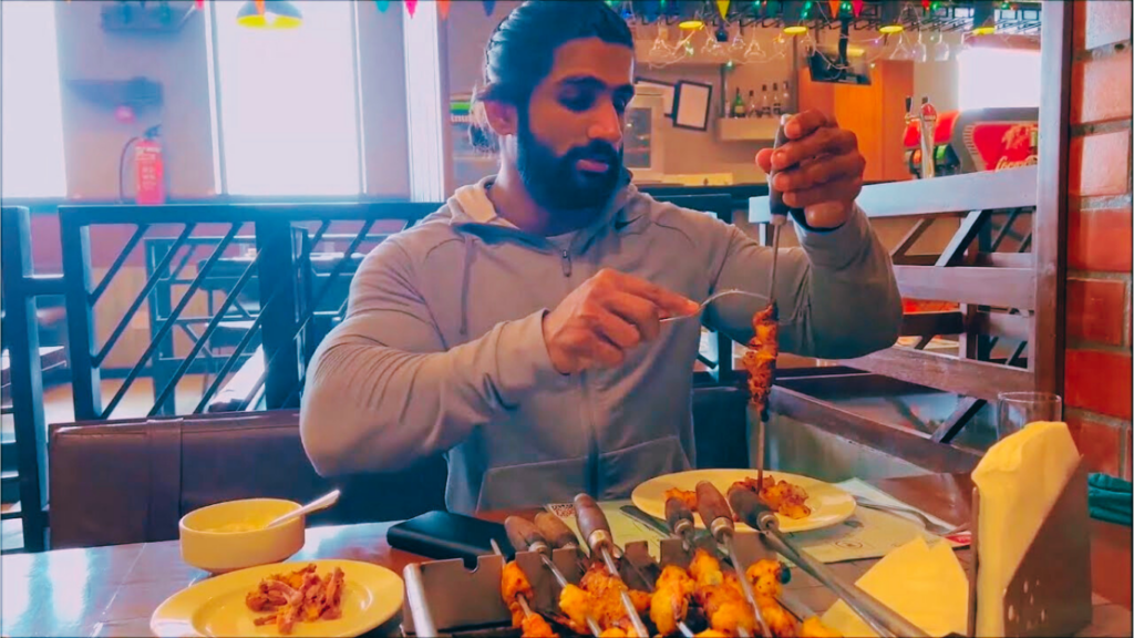 Bodybuilder Eating In A Restaurant 