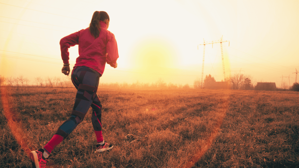 A Woman Jogging On A Field