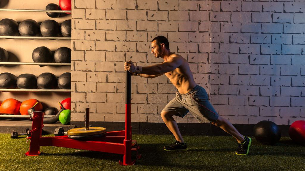 A Man Doing Sled Pushes