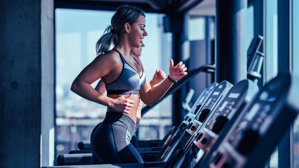 A Woman Running On A Trademill Machine