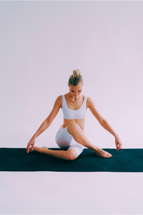 A woman in a yoga pose for the fitness category Yoga 