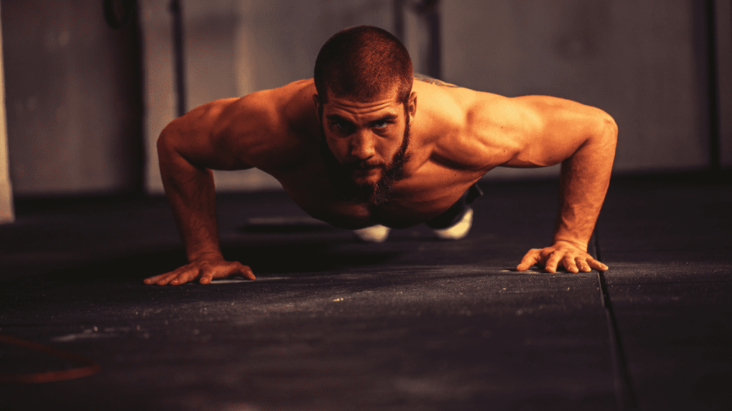 A Man Doing Push Up Holds 