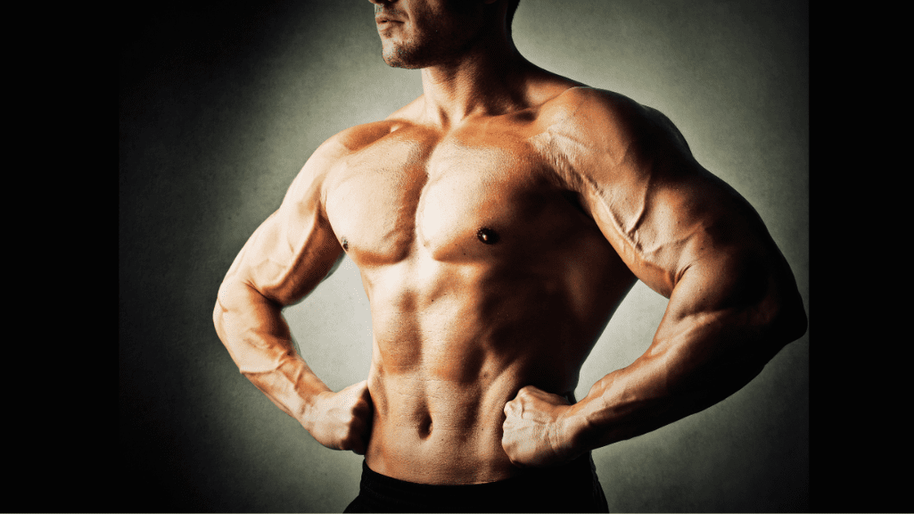 How to Build Strength Without Mass: a man with a developed lean muscles 